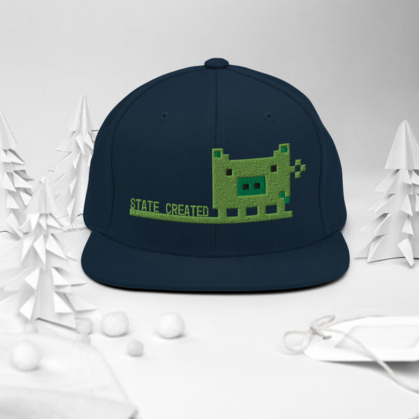 Pixel Pig embroidered on a snapback — dark navy, front angle
